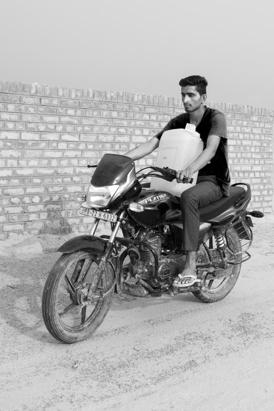 Men and Drinking Water Procurement - Transporting sweet water for the family in Fazilka district, Punjab